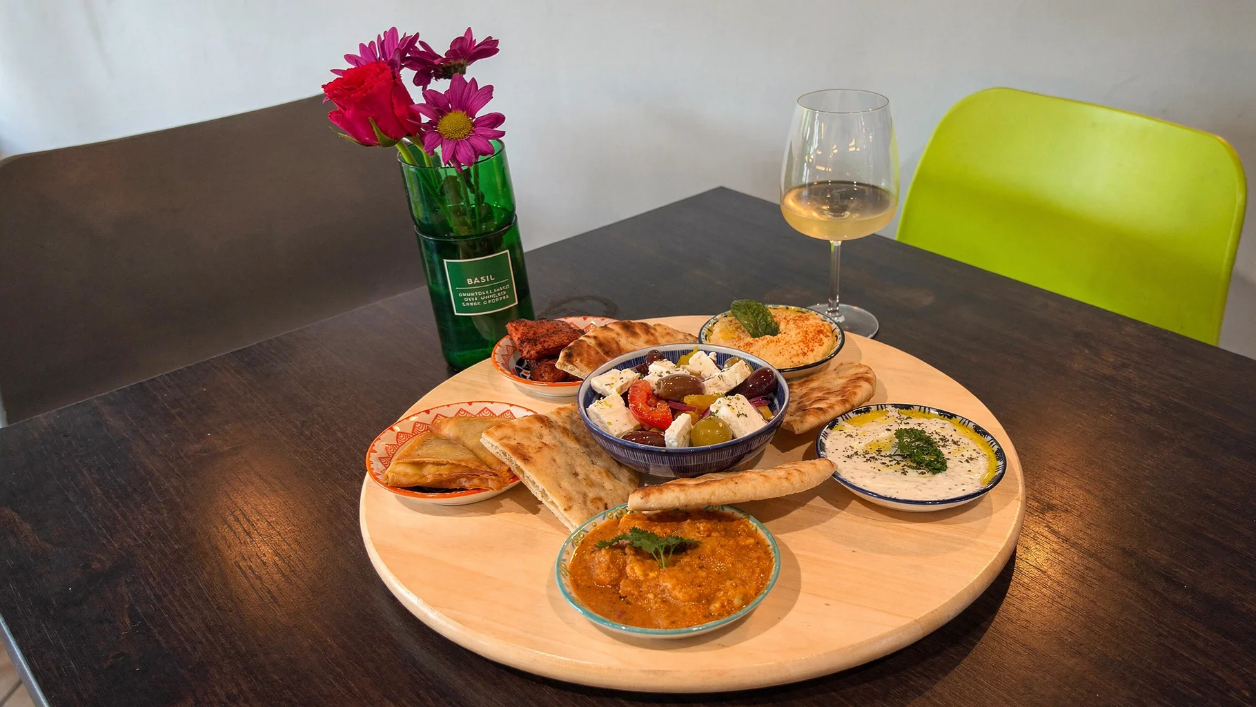 Meze board with Greek salad, hummus, tzatziki, pita and the BASIL vase
